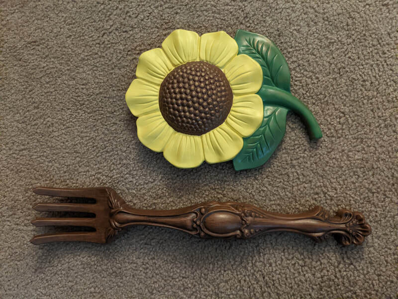 Large sunflower and fork wall hangings