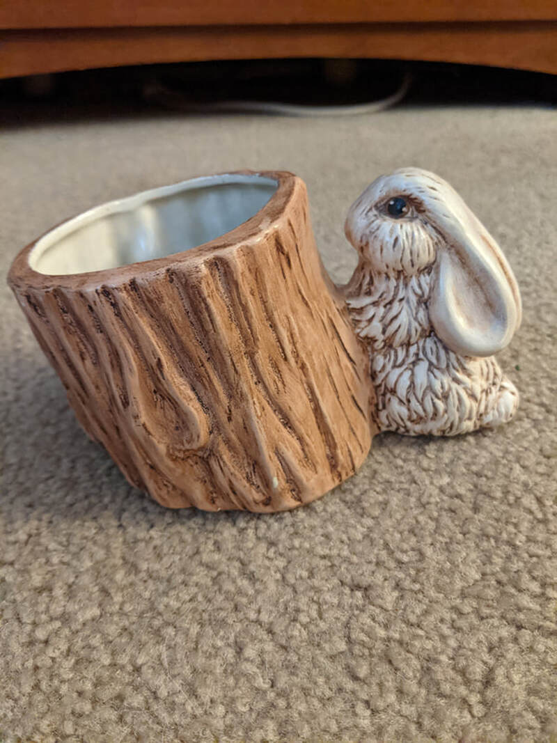 Bunny and hollow stump